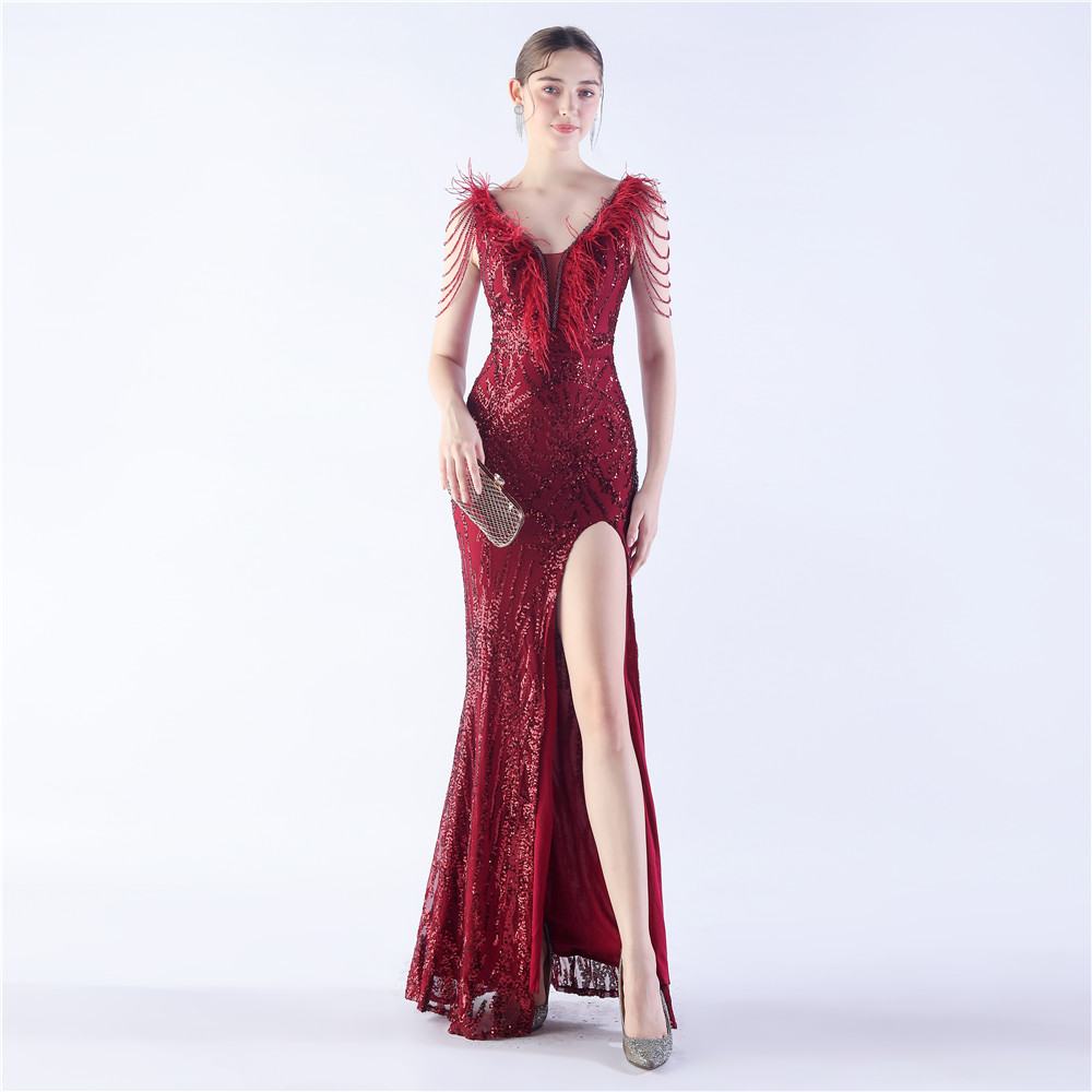 H98669825e98549f087a67642ea14752eh.jpg Luxelle8 Heavy Beaded Feather Sequin Evening Gown - Image 1